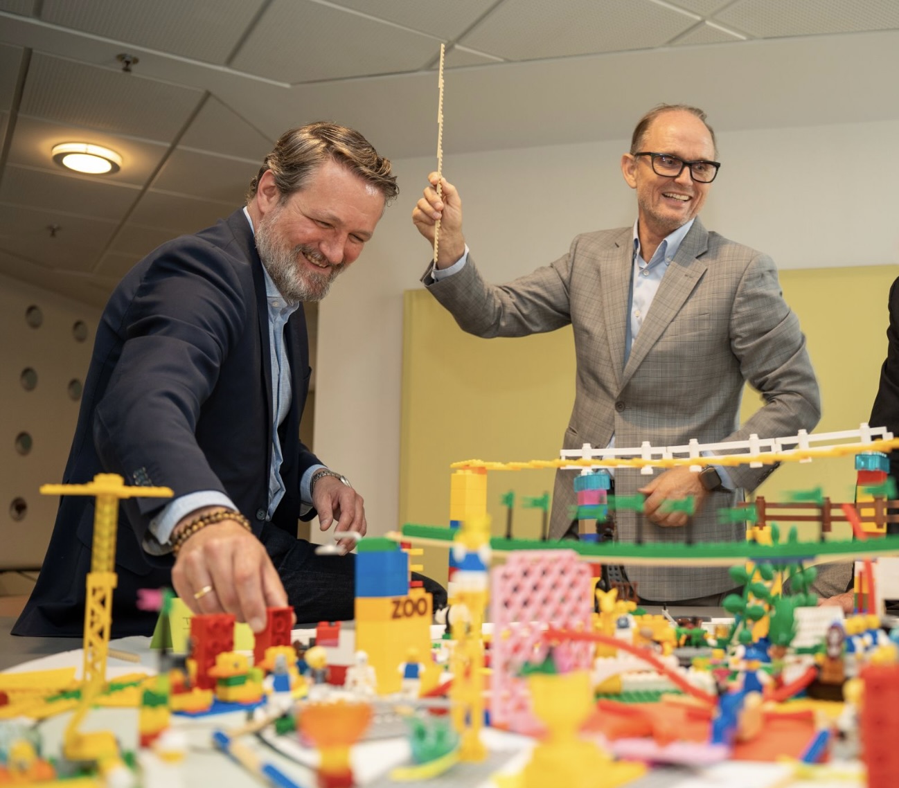 Johan Roos and Micael Buckle, CEO of Inthrface, building a model during a LEGO Serious Play training session.