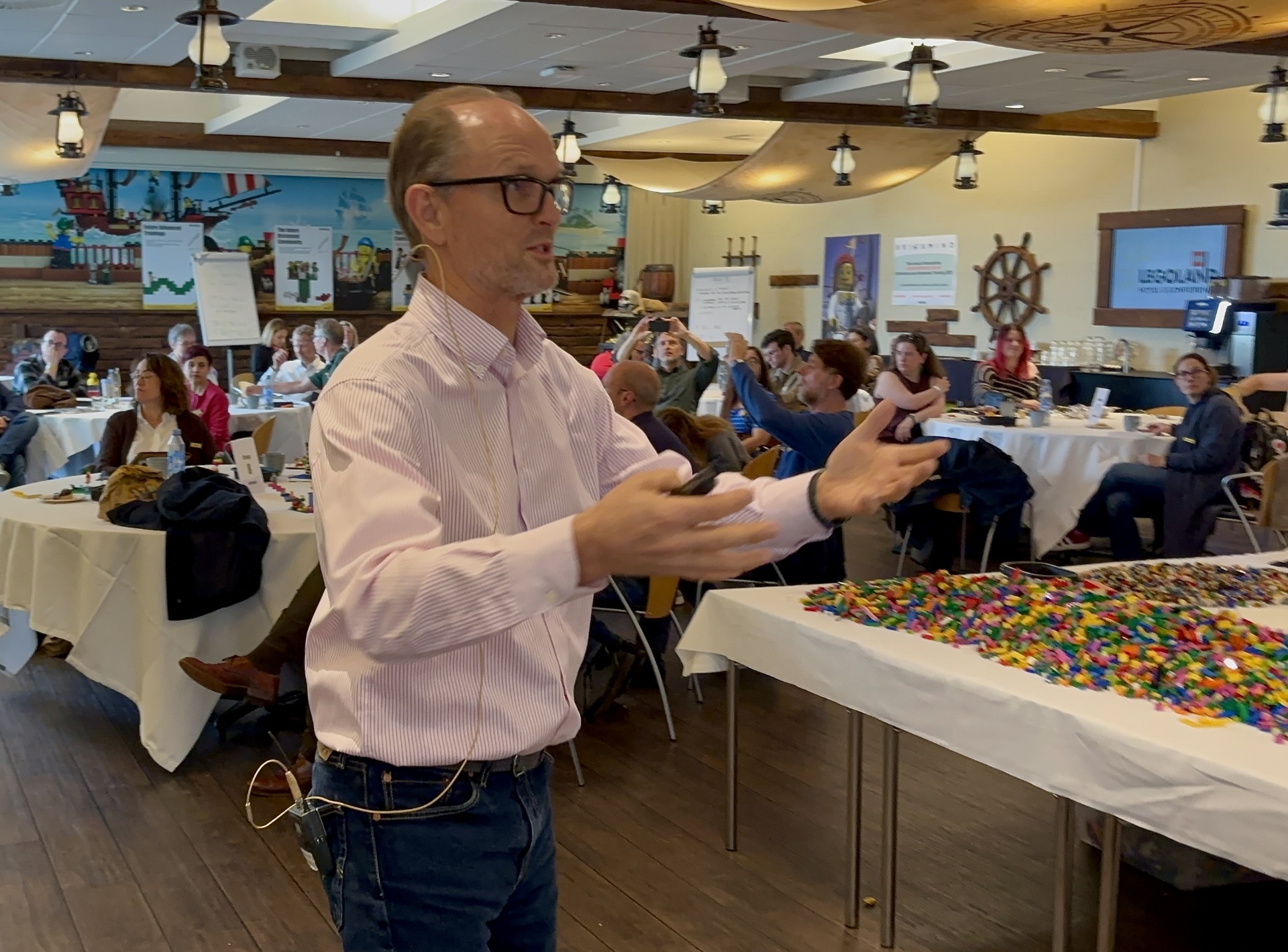 Johan Roos leading a LEGO Serious Play session with a full audience.