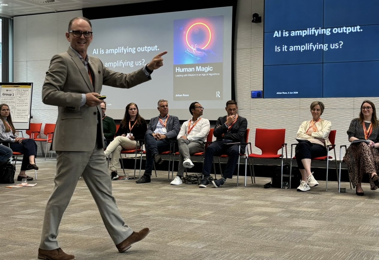 Johan Roos delivering a Human Magic keynote, presenting to an engaged audience.
